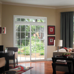 living room with hardwood floors of a home with new sliding door leading to backyard