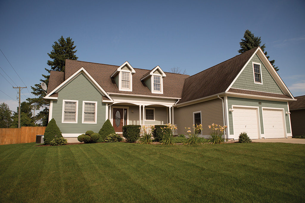 home with new windows, doors, and siding installed by APCO