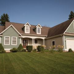 home with new windows, doors, and siding installed by APCO