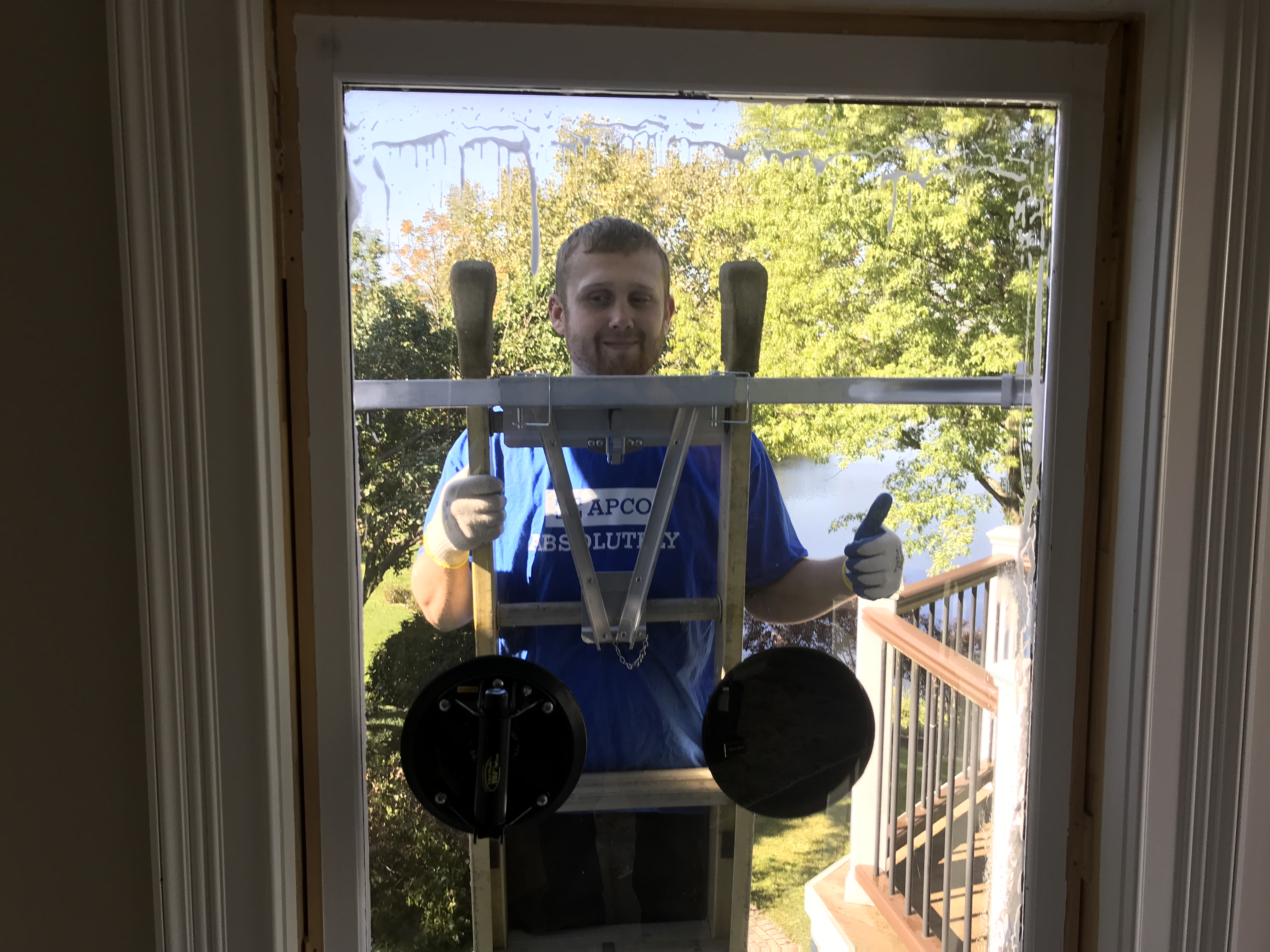 APCO window installation technician installing a window