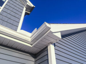 A low angle view of soffit, gutters, downspout